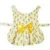 Child's dress with pineapple pattern and bow.