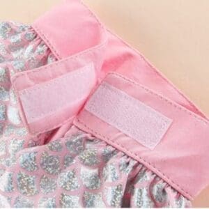 Elegant woman posing in stylish urban outfit.